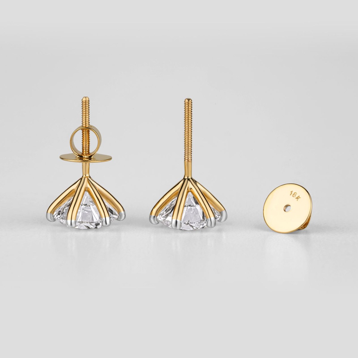 Pair of round brilliant diamond stud earrings with yellow-gold screw backs marked 18K